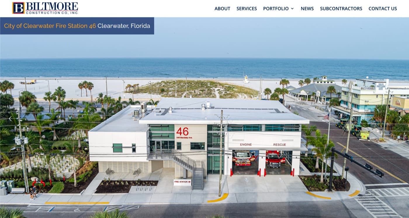 The Biltmore Construction homepage Emboss built, an aerial photograph of City of Clearwater Fire Station 46 with the beach and the Gulf behind it